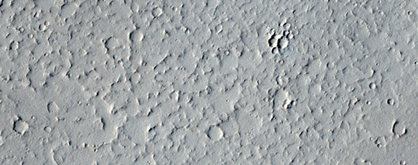 Fluvial-Like Channels and Karst-Like Pit along Tractus Catena