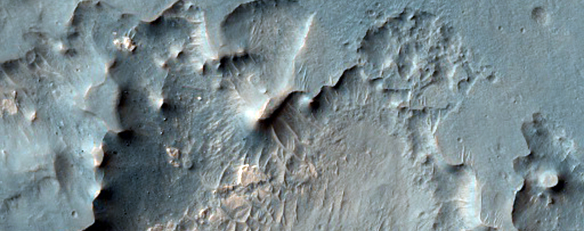 Light-Toned Deposits and Possible Fluvial Channels on Floor of Ius Chasma