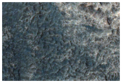 Pits Exposing Layered Bedrock