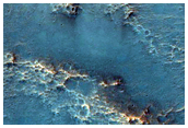 Possible Olivine-Rich Terrain North of Hellas Planitia