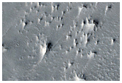 Faulted Layered Deposits in Capen Crater