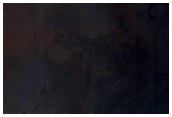 Light-Toned Sedimentary Rocks Exposed in Syrtis Major Region Scarp