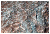 Bedrock Exposures in Uzboi Vallis and a Crater Rim