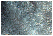 Impact Crater into Heavily Mantled Pole-Facing Slope