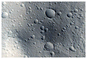 Crater Surrounded by Pyramidal and Elliptical Dome Hills