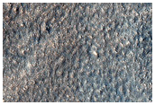 Possible Stream Features in Mountain Valleys Near Hellas Basin