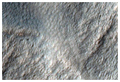 Disrupted Crater Rim next to Scarp