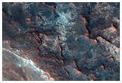 Mawrth Vallis Strata with Interesting Geometry Exposed in Small Crater