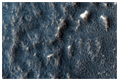 Tilted Layers in Crater Deposit in Hellas Montes Region