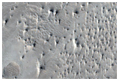 Faulted Layered Deposits in Capen Crater