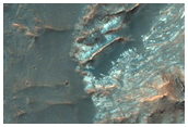Central Pit of an Impact Crater with Layered Bedrock