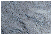 Layers in Pedestal Crater within Tikhonravov Crater