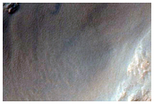 Crater with Central Peak Exposing Bedrock
