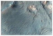 Exposures of Layered Bedrock Northwest of Hellas Basin