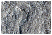 Layered Deposits in Crater in Hellas Montes Region
