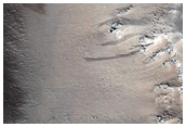 Shallow Pits with Buttes in Tractus Fossae