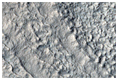 Layered Deposits in Crater in Hellas Montes Region