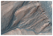 Crater Rim with Bedrock Layers and Gullies