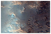 Bedrock Exposed in 60-Kilometer Crater East of Valles Marineris