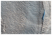 Pits and Cracks in a Crater