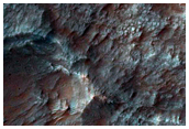 Bedrock Exposed in Rim and Terraces of Crater in Molesworth Crater