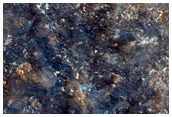 Olivine-Rich Crater and Flow Features in Solis Planum