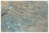 Sinuous Ridge and Layers at Valley Intersection with Crater Floor
