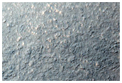 Tongue-Shaped Flow Features South of Reull Vallis