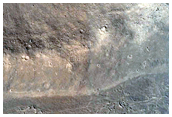 Plains-Forming Flow and Associated Trough Cut in Crater Wall