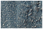 Debris Overtopping Crater Rim and Flowing onto Neighboring Plains