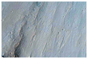 Possible Hydrate-Rich Terrain in Geryon Montes Wallrock in Ius Chasma