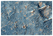 Low Albedo Terrain in Gusev Crater