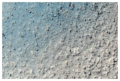 Layered Mesa-Forming Material in Crater Southeast of Hellas Planitia