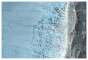 Crater in Solis Planum with Potential Olivine-Rich Ejecta