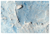 Curved Ridge Intersection with Light-Toned Material in West Arabia Terra