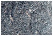 Tongue-Shaped Flow Feature in Promethei Terra