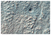 Inverted Channels and Fans on Southwest Rim of Kaiser Crater