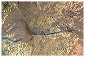 Light-Toned Materials on the Floor of Coprates Chasma