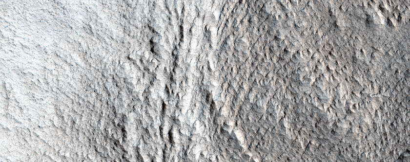 Massifs with Aprons and Lineated Valley Floor Material