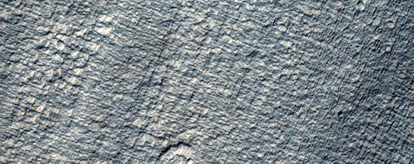 Fan-Like Features on North Side of Crater Ejecta Near Reull Vallis