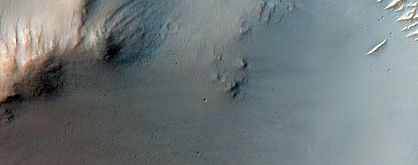 Valley Breaching Rim of Madler Crater