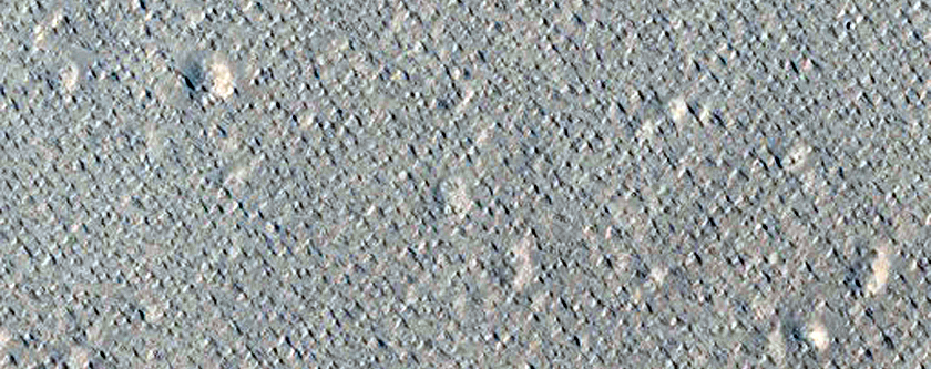 Pits and Channels Southwest of Tooting Crater Near Ejecta