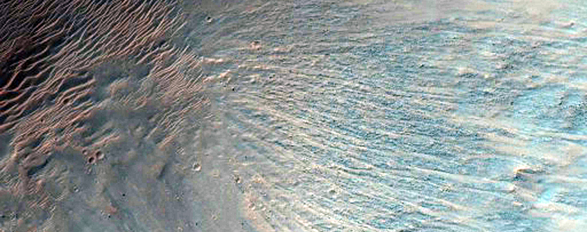 Light-Toned Layering along Floor of Small Trough Near Juventae Chasma