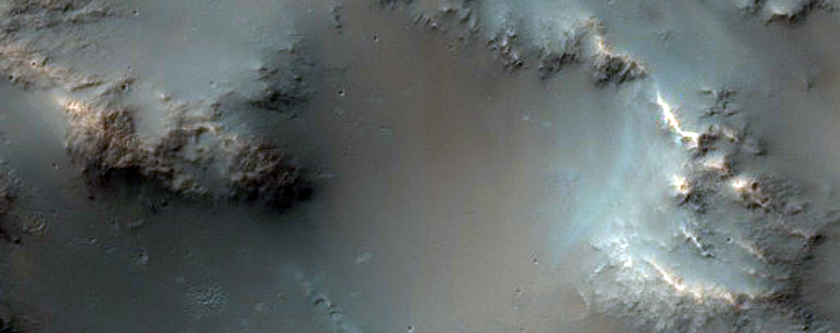 Low-Calcium Pyroxene on Ridge Embayed by Olivine-Bearing Plains