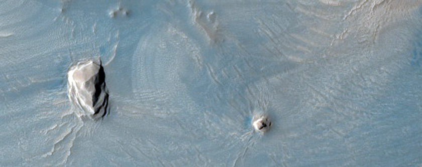 Dark Materials on West Flank of Olympus Mons