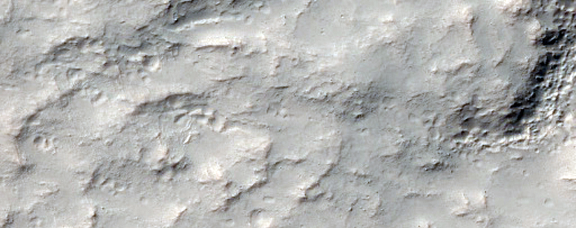 Possible Olivine-Rich Crater in Thaumasia Planum