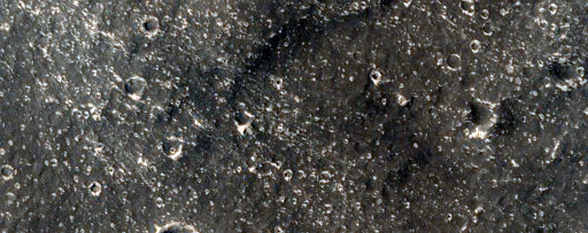 Crater Ejecta Blanket in Contact with Various Mesas and Buttes