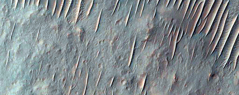 Light-Toned Material along Coprates Chasma Ridge