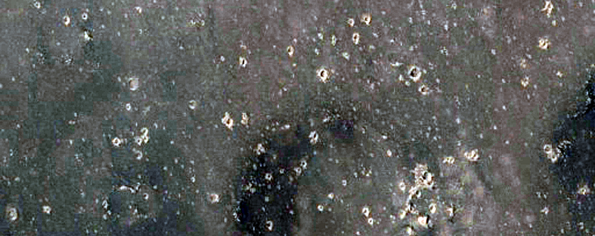 Crater Ejecta Material in Contact with Mesas and Buttes