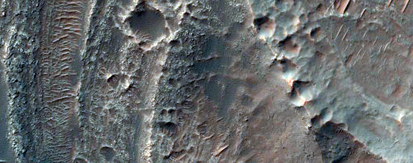 Layered Deposits in Central Pit of Large Crater